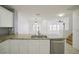 Open concept kitchen featuring granite countertops and stainless steel dishwasher at 2120 Waterlily View St, Henderson, NV 89044