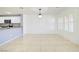 Bright living room featuring tiled floors, modern lighting, and easy access to kitchen at 2120 Waterlily View St, Henderson, NV 89044