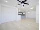 Bright open-concept living space with tile flooring and easy access to kitchen at 2120 Waterlily View St, Henderson, NV 89044
