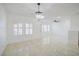 Bright living room featuring tiled floors, modern lighting, and bright white walls at 2120 Waterlily View St, Henderson, NV 89044