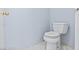Clean bathroom featuring a modern toilet and white tiled floors at 2419 Country Orchard St, North Las Vegas, NV 89030