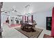 Open-concept dining room showcasing a spacious layout, modern lighting, and seamless flow into the kitchen area at 2419 Country Orchard St, North Las Vegas, NV 89030