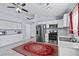 Bright kitchen with white cabinets, stainless steel appliances, and marble floors at 2419 Country Orchard St, North Las Vegas, NV 89030