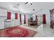 Bright eat-in kitchen with marble floors, a ceiling fan, and a dining set at 2419 Country Orchard St, North Las Vegas, NV 89030
