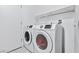 Convenient laundry room featuring a modern washer and dryer, perfect for efficient laundry care at 2419 Country Orchard St, North Las Vegas, NV 89030
