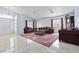 Spacious living room featuring marble floors, neutral walls, and traditional-style furniture at 2419 Country Orchard St, North Las Vegas, NV 89030