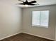 Bedroom with plush carpeting, ceiling fan and a window for natural light at 4117 Midnight Crest Ave, North Las Vegas, NV 89031