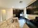 Stylish kitchen featuring a granite island, black appliances, and ample cabinet space at 4117 Midnight Crest Ave, North Las Vegas, NV 89031