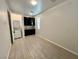 View of a laundry room with a washing machine, dryer, cabinets, sink, tile flooring and a window at 4117 Midnight Crest Ave, North Las Vegas, NV 89031