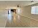 Spacious living room featuring tile flooring and a ceiling fan, perfect for relaxing or entertaining at 4117 Midnight Crest Ave, North Las Vegas, NV 89031
