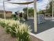 Community playground area featuring climbing wall and green slide amidst desert landscaping at 4117 Midnight Crest Ave, North Las Vegas, NV 89031