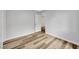 Bright bedroom has light gray walls and wood-look flooring at 5576 W Rochelle Ave # 9C, Las Vegas, NV 89103