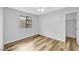 Bright bedroom has light gray walls and wood-look flooring at 5576 W Rochelle Ave # 9C, Las Vegas, NV 89103