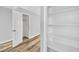 Bedroom doorway revealing built-in shelves and a second doorway, enhancing storage and flow at 5576 W Rochelle Ave # 9C, Las Vegas, NV 89103