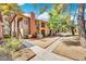 View of the building exterior showcasing manicured grounds and walkway at 5576 W Rochelle Ave # 9C, Las Vegas, NV 89103