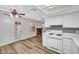 This kitchen overlooks an adjacent room with a fireplace at 5576 W Rochelle Ave # 9C, Las Vegas, NV 89103