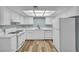 Bright kitchen features white cabinets, countertops, and appliances at 5576 W Rochelle Ave # 9C, Las Vegas, NV 89103
