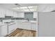 Updated kitchen with white cabinets, counter, and appliances at 5576 W Rochelle Ave # 9C, Las Vegas, NV 89103