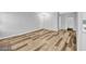 Spacious living area with wood-look floors and neutral paint at 5576 W Rochelle Ave # 9C, Las Vegas, NV 89103