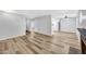 Open-concept living space with wood-look floors at 5576 W Rochelle Ave # 9C, Las Vegas, NV 89103
