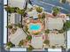 Community aerial view showcasing condo buildings, pool, spa, landscaping, and parking at 5710 E Tropicana Ave # 1184, Las Vegas, NV 89122