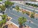 Aerial view of the community, showcasing landscaping, parking, and nearby commercial area at 5710 E Tropicana Ave # 1184, Las Vegas, NV 89122