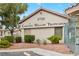 Exterior view of a community building with well-manicured landscaping and visible signage at 5710 E Tropicana Ave # 1184, Las Vegas, NV 89122