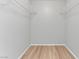 Walk-in closet featuring laminate flooring and wire shelving at 5710 E Tropicana Ave # 1184, Las Vegas, NV 89122