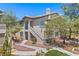 Inviting condo featuring a well-maintained exterior with stucco siding and desert landscaping at 5710 E Tropicana Ave # 1184, Las Vegas, NV 89122