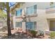Close up of a ground level condo, showing windows and beige stucco exterior at 5710 E Tropicana Ave # 1184, Las Vegas, NV 89122