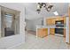 Bright kitchen features tile flooring, wood cabinets, and modern appliances at 5710 E Tropicana Ave # 1184, Las Vegas, NV 89122