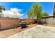 Outdoor backyard with a BBQ grill and concrete patio; perfect for entertaining at 6057 Leaping Foal St, North Las Vegas, NV 89081