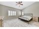 Bright bedroom with marble tile, vaulted ceiling, shutters, ceiling fan, and ample natural light at 6057 Leaping Foal St, North Las Vegas, NV 89081