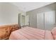 Bedroom featuring a dresser, closet, and a view into the bathroom at 6057 Leaping Foal St, North Las Vegas, NV 89081