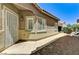 Home exterior featuring desert landscaping, a secure front door, and white trimmed windows at 6057 Leaping Foal St, North Las Vegas, NV 89081