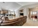 Open concept living room featuring tiled floors, modern lighting, and a spacious seating area at 6057 Leaping Foal St, North Las Vegas, NV 89081