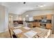 Open floor plan integrating the kitchen, dining area, and living room for seamless living at 6057 Leaping Foal St, North Las Vegas, NV 89081