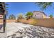 The large backyard features a covered patio and minimalist landscaping at 9321 Dancing Daffodil Ave, Las Vegas, NV 89129