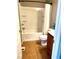 Full bathroom features a shower-tub combination, tile floors, and a vanity at 10450 Badger Ravine St, Las Vegas, NV 89178