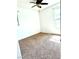 Cozy bedroom with a ceiling fan and window providing natural light at 10450 Badger Ravine St, Las Vegas, NV 89178