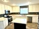 Bright kitchen boasts stainless appliances, tiled backsplash, and spacious countertops at 10450 Badger Ravine St, Las Vegas, NV 89178