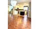 Open-concept kitchen with stainless steel appliances, center island, and hardwood floors at 10450 Badger Ravine St, Las Vegas, NV 89178