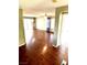 Open floor plan with hardwood floors leading into a bright living room and dining area at 10450 Badger Ravine St, Las Vegas, NV 89178