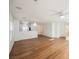 Open-concept living area featuring wood-look flooring and plenty of natural light at 1161 Gecko Rd, Henderson, NV 89002