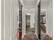Hallway with storage on both sides and tile floors lead to the bathroom at 2822 Soft Horizon Way, Las Vegas, NV 89135
