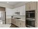Well-appointed kitchen with marble countertops, stainless steel appliances, and gas range at 2822 Soft Horizon Way, Las Vegas, NV 89135