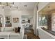 Open-concept living room with bar, kitchen, and outdoor living area at 2822 Soft Horizon Way, Las Vegas, NV 89135