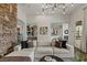 Bright living room with stacked stone accent wall and luxury furnishings at 2822 Soft Horizon Way, Las Vegas, NV 89135