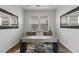 Office features modern desk, dual mirrors and two windows at 2822 Soft Horizon Way, Las Vegas, NV 89135