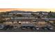 Aerial view of a residential complex at sunset, complete with mountain backdrop at 3008 Saint George St # F, North Las Vegas, NV 89030